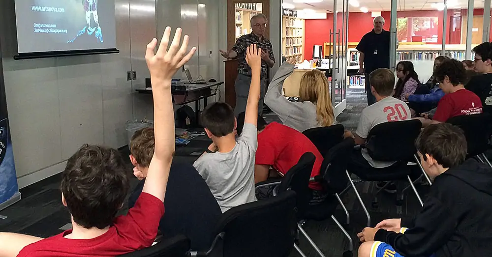 Jim Plaxco speaking to a group of high school students